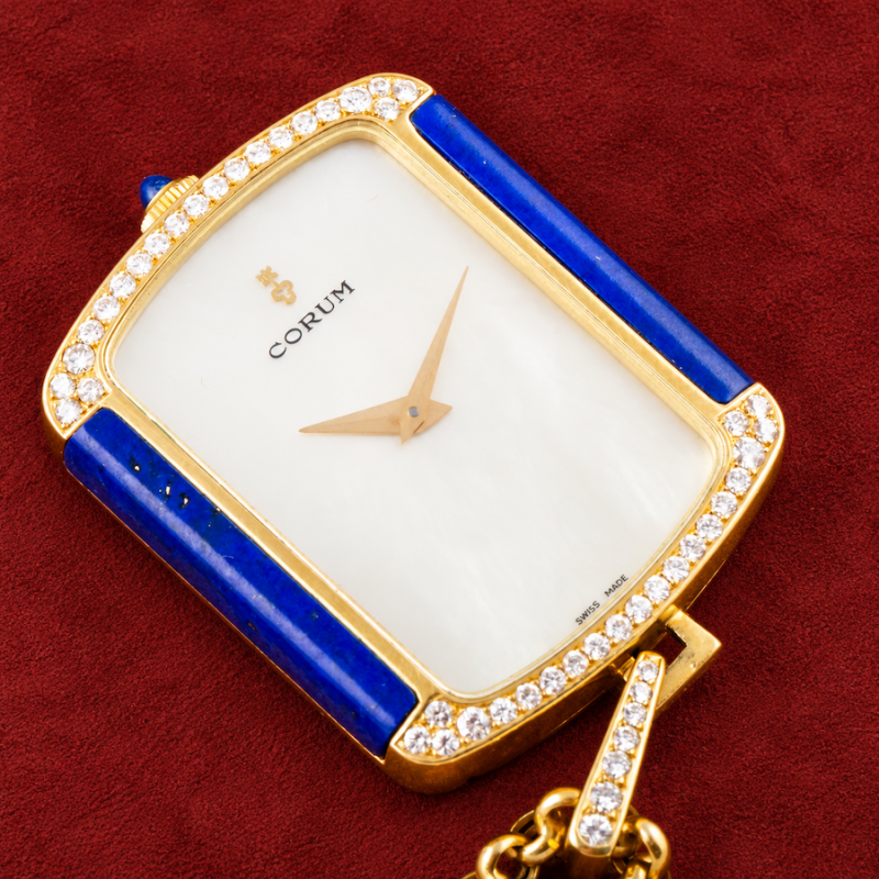 Corum YELLOW GOLD PENDANT WATCH WITH LAPIS LAZULI, MOTHER OF PEARL, DIAMONDS AND GOLD CHAIN