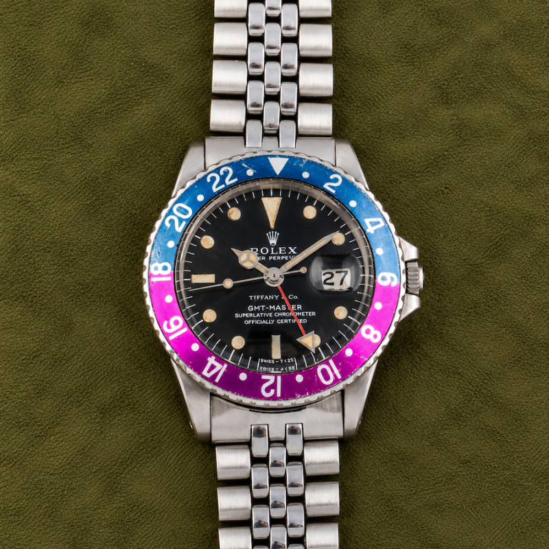 Rolex GMT-MASTER REF. 1675 RETAILED BY TIFFANY & CO. WITH “LONG E “ DIAL AND FUCHSIA BEZEL IN STAINLESS STEEL